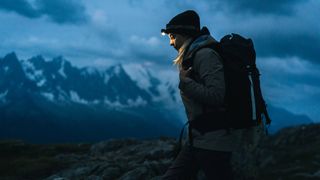 best headlamps: hiker with headlamp