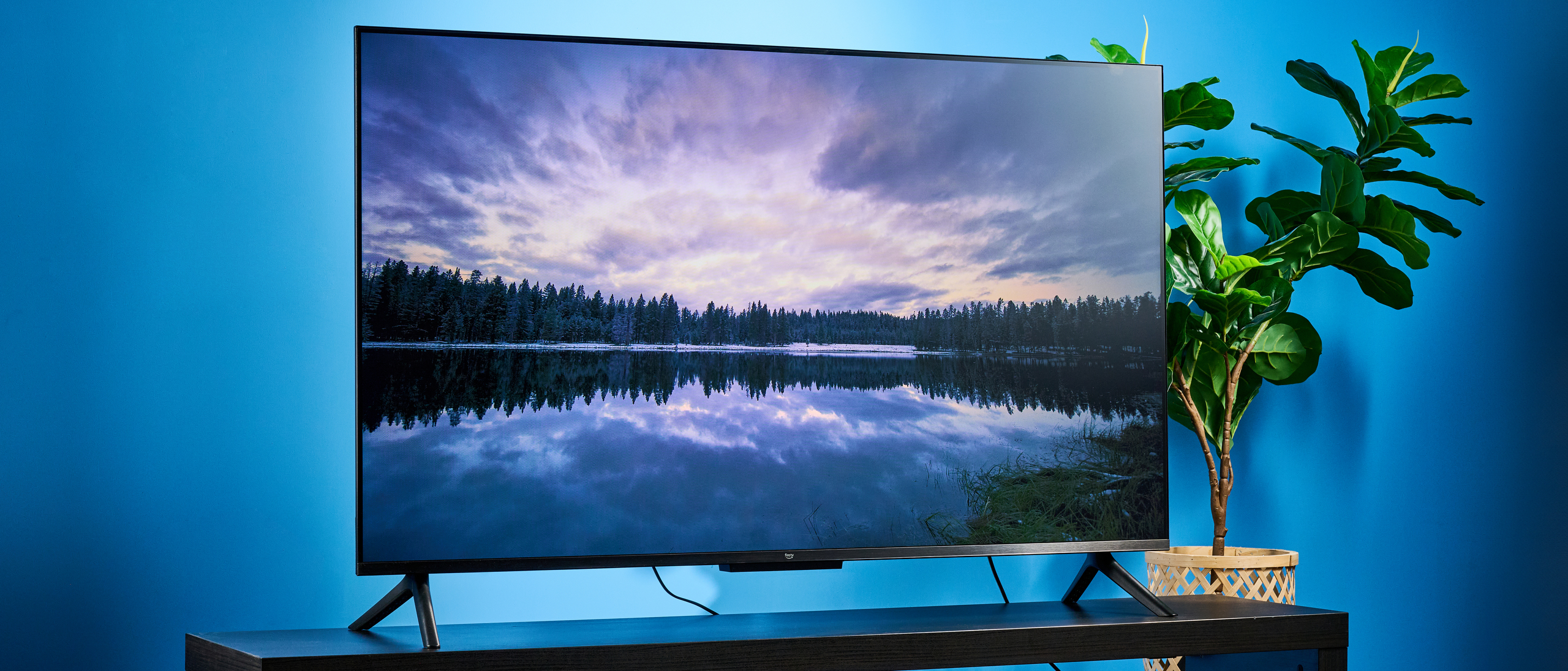 the amazon ember 4-series TV photographed against the blue tom's guide background