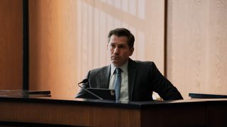 Michael Goorjian as Alex Grant on the witness stand in The Lincoln Lawyer season 2 episode 9