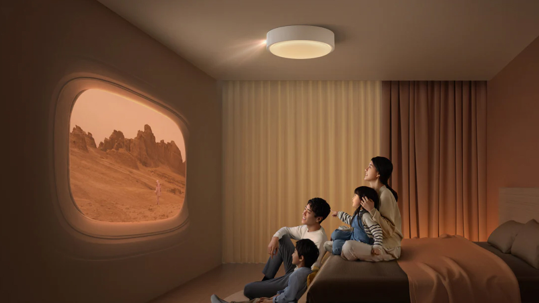 The XGIMI Aladdin projector on a ceiling above a family enjoying a film