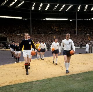 Billy McNeill (Scotland) and Bobby Moore (England)
