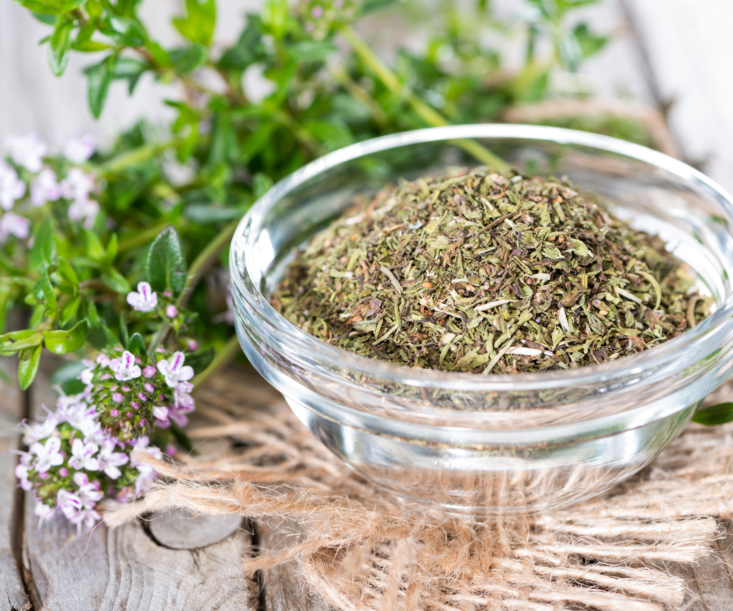winter savory herbs in dish and on table
