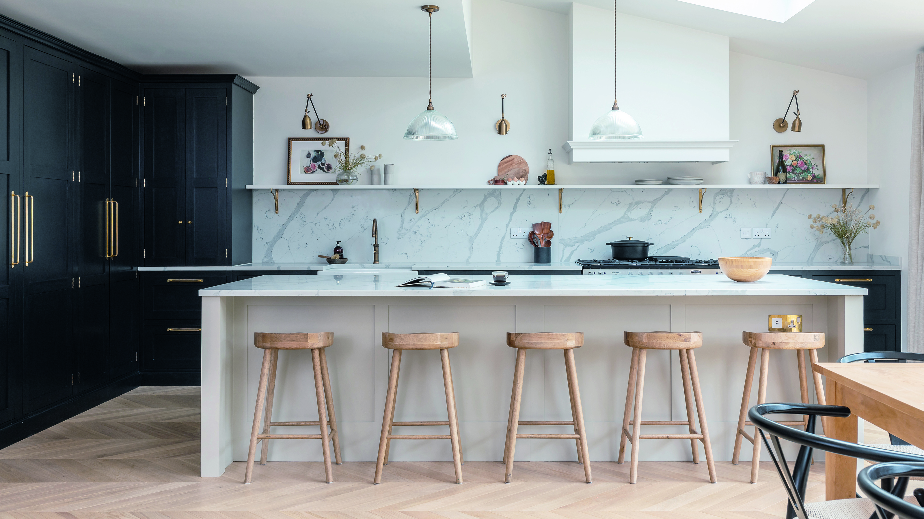 Large open plan kitchen with island and dual-tone palette.