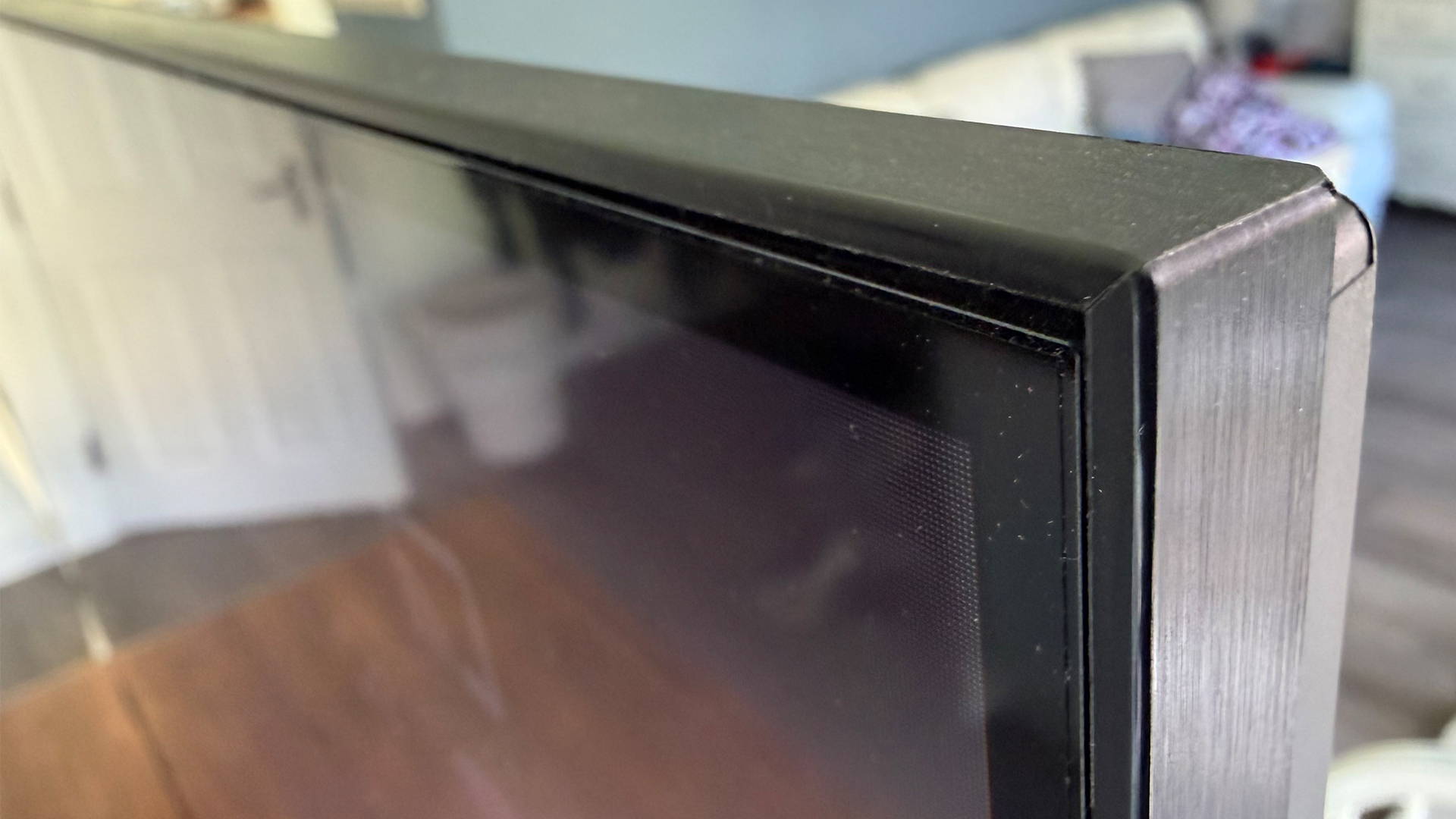 TCL Q6C 65-inch LCD TV focus on top right corner of screen