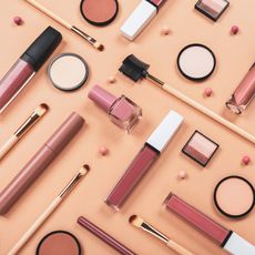 makeup products on a beige background