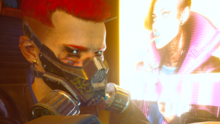 V from Cyberpunk 2077 looks ahead, while a vending machine with bright neon glow illuminates his face.