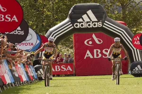 Christoph Sauser and Burry Stander cross the finishing line