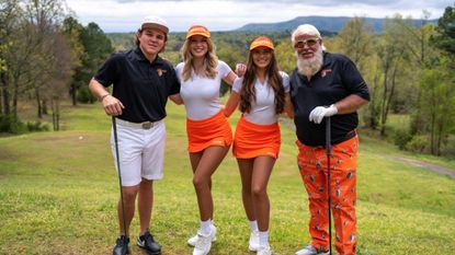 John Daly and John Daly II pose with Hooters girls