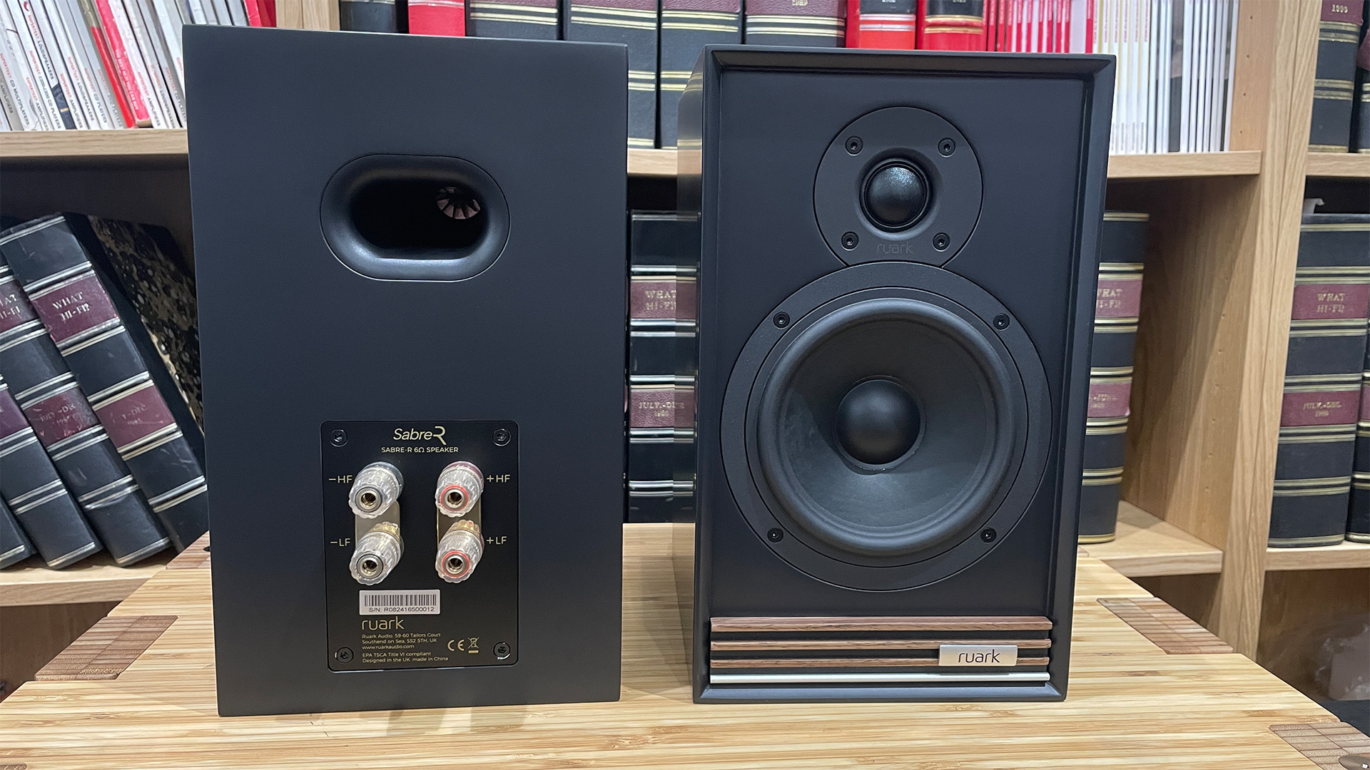 Ruark Audio Sabre-R speakers in black finish on wooden rack