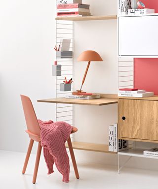 A String shelving unit with desk component