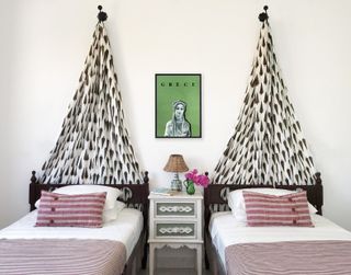 Twin bedroom with patterned canopy