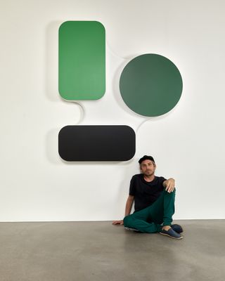 ïto sat beneath one of his works on show at Galerie Podgorny