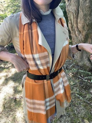 Woman wearing a plaid scarf