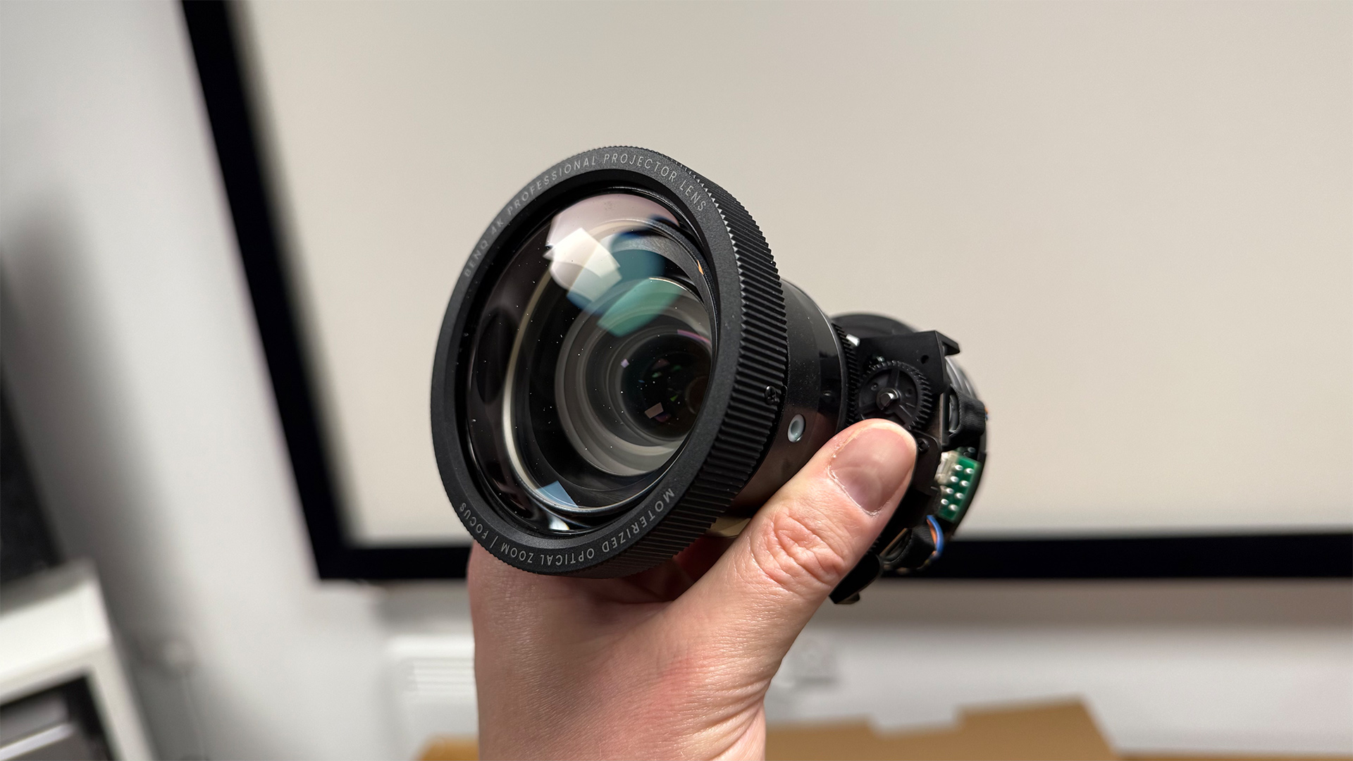 BenQ W5850 home cinema projector lens held in hand