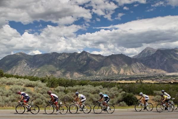 Riders leave the mountains they just crossed over.