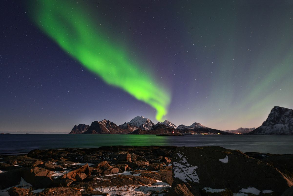 The northern lights shimmer over the Lofoten islands in Norway. A geomagnetic storm may amplify the northern lights on March 14 and 15, 2018.