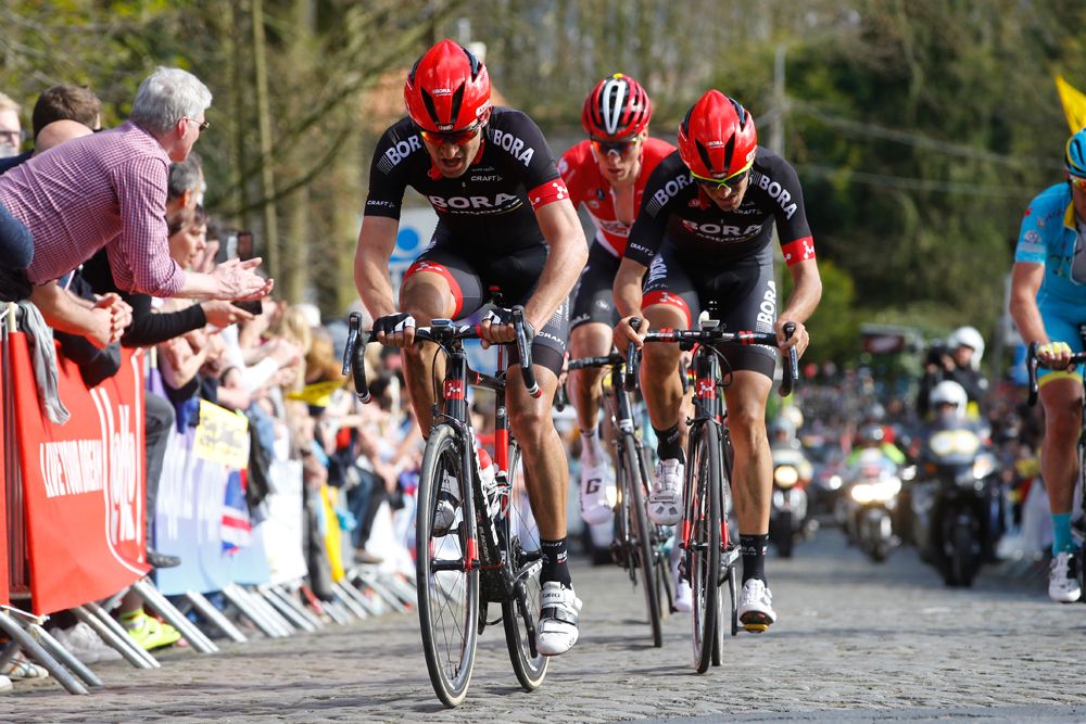 The Bora-Argon 18 riders riding along the cobbles