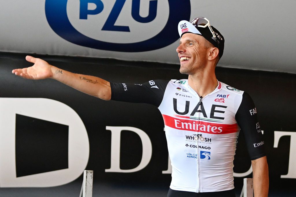 OPOLE POLAND AUGUST 01 Rafa Majka of Poland and UAE Team Emirates celebrates at podium as Best Polish Rider Jersey winner during the 80th Tour de Pologne 2023 Stage 4 a 1991km stage from Strzelin to Opole UCIWT on August 01 2023 in Opole Poland Photo by Dario BelingheriGetty Images
