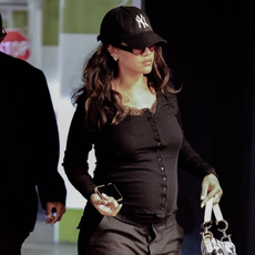 rihanna wears cargo pants and camo dior saddle bag