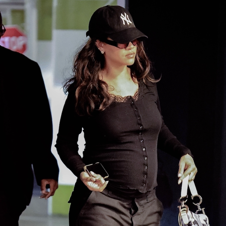 rihanna wears cargo pants and camo dior saddle bag