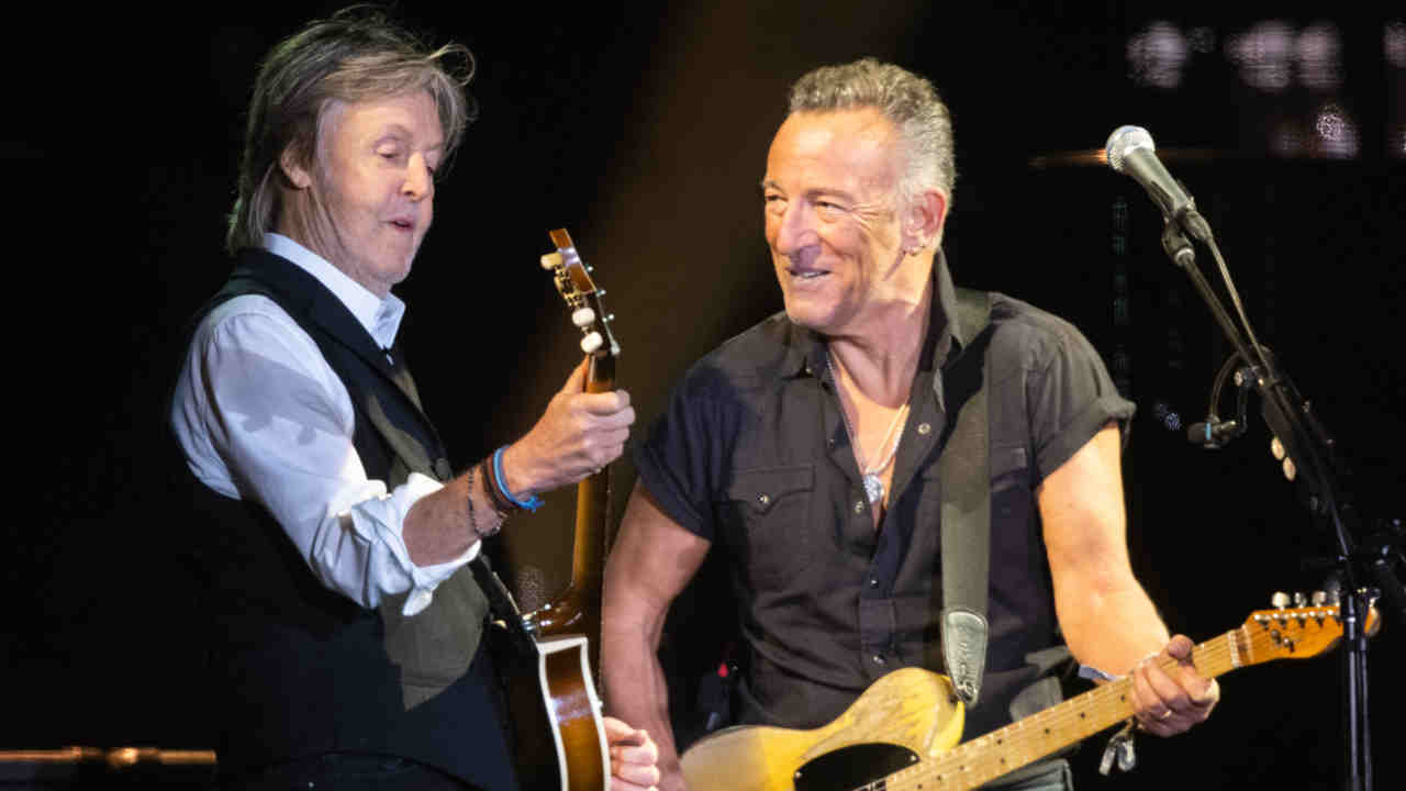Paul McCartney and Bruce Springsteen performing onstage at Glastonbury in 2022