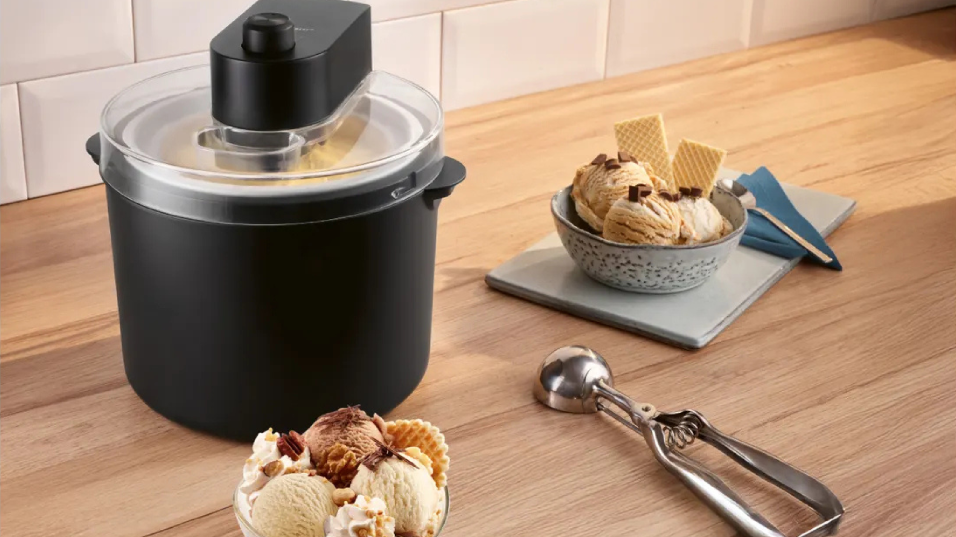 Lidl ice cream maker and two bowls of caramel ice cream next to it.
