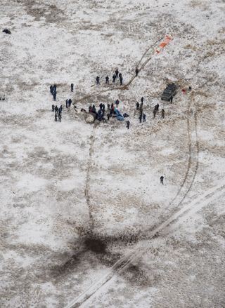 Russian search and recovery forces are seen from above at the Soyuz TMA-13M landing site in Kazakhstan, Nov. 9, 2014