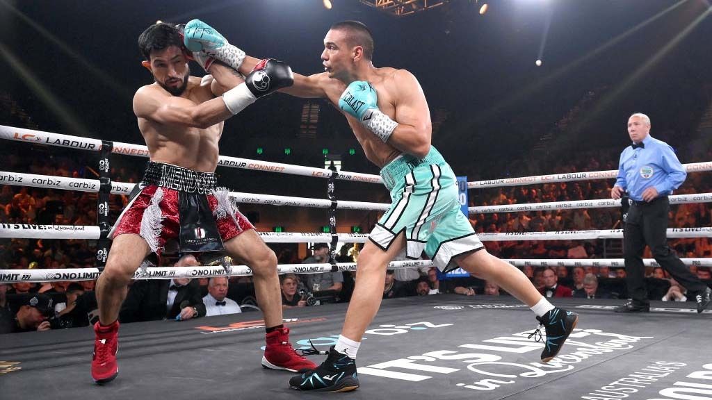 Tim Tszyu connects with a punch against Brian Mendoza during their 2023 WBO super-welterweight title fight.