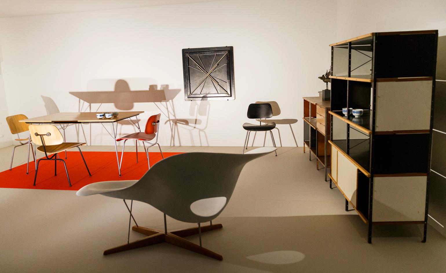 Installation shot, featuring the Eameses' 'La Chaise' in the foreground.