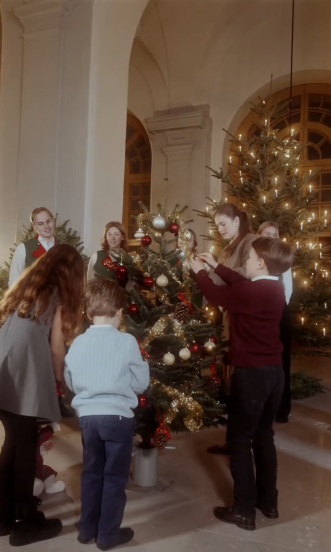 Members of the Swedish royal family decorating a tree