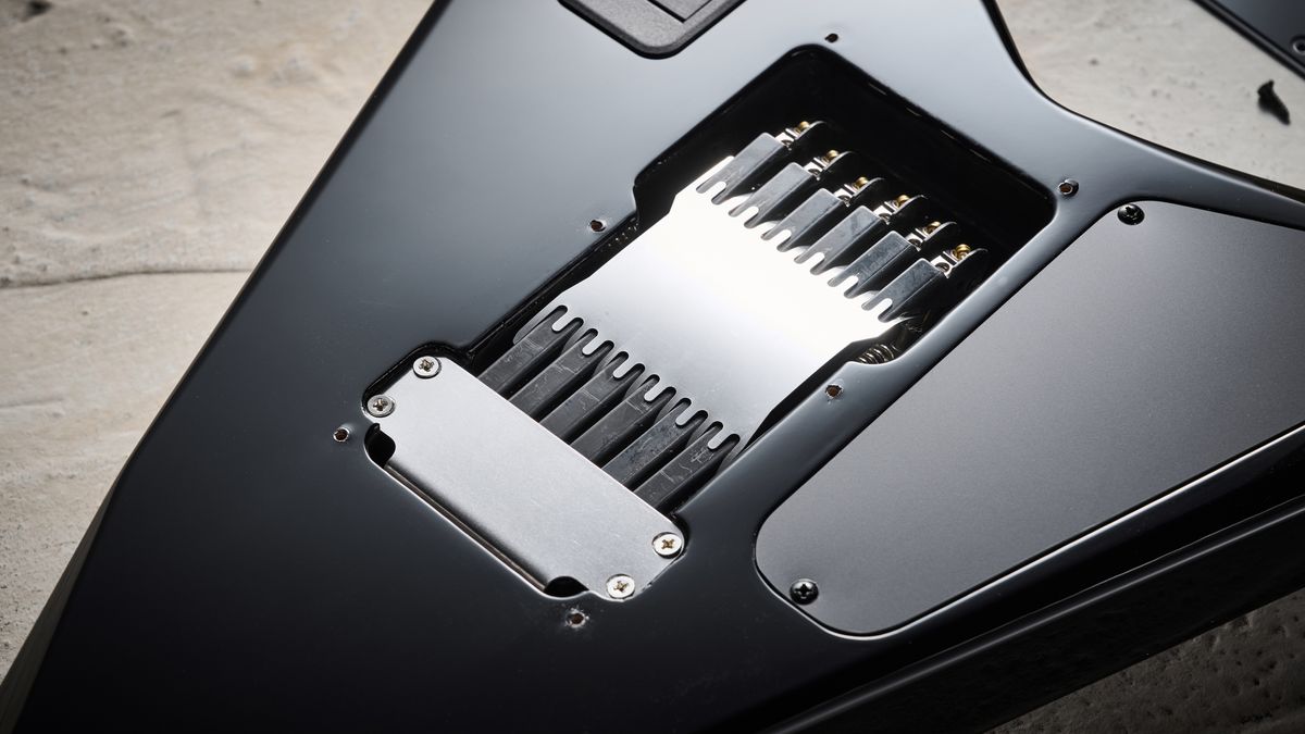 The back of the Evertune bridge on the Jackson Pro Plus Series Signature Christian Andreu Rhoads RR24 EVTN6 electric guitar