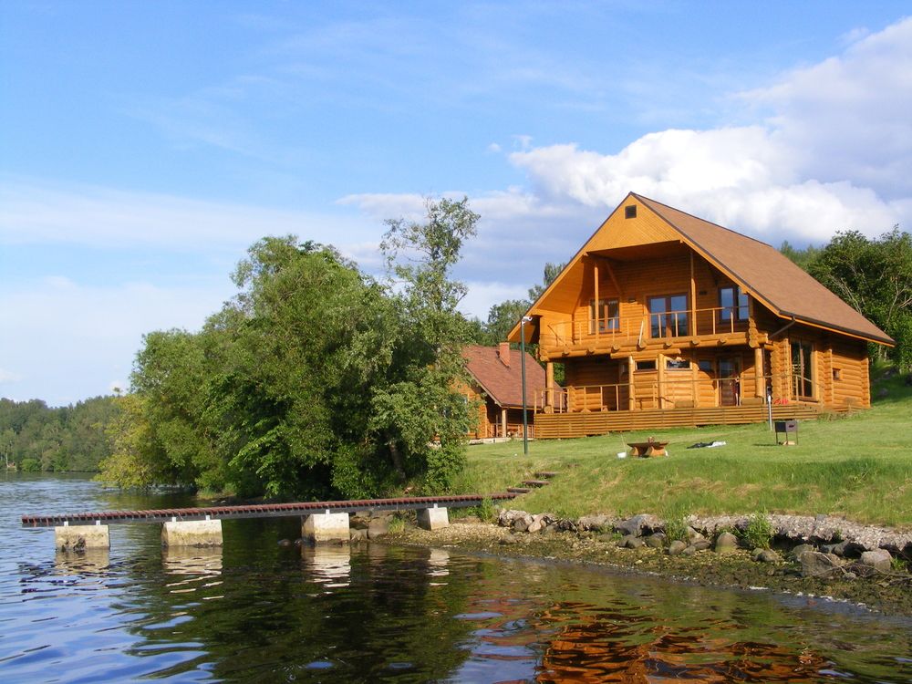 A country house next to a lake