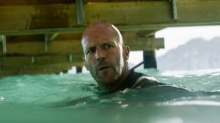 Jonas in water under dock in The Meg 2: The Trench