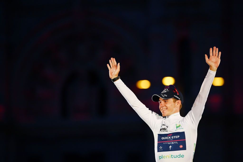 MADRID SPAIN SEPTEMBER 11 Remco Evenepoel of Belgium and Team QuickStep Alpha Vinyl celebrates winning the White Best Young Jersey on the podium ceremony after the 77th Tour of Spain 2022 Stage 21 a 967km stage from Las Rozas to Madrid LaVuelta22 WorldTour on September 11 2022 in Madrid Spain Photo by Tim de WaeleGetty Images