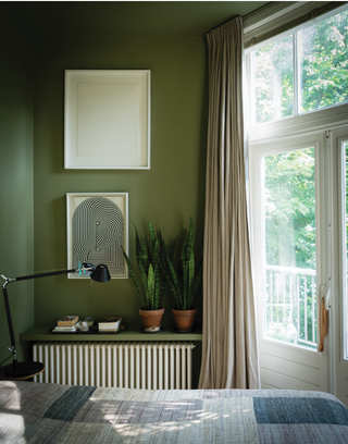 A moss green paint in the bedroom