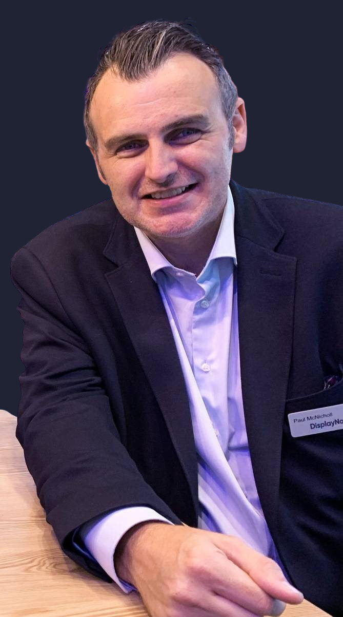 Smiling headshot of Paul McNicholl.