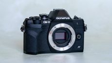 Olympus OM-D E-M10 Mark IV on a plain background