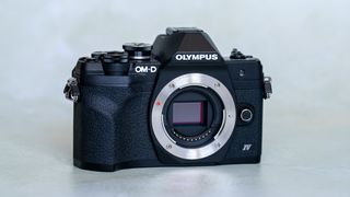 Olympus OM-D E-M10 Mark IV on a plain background
