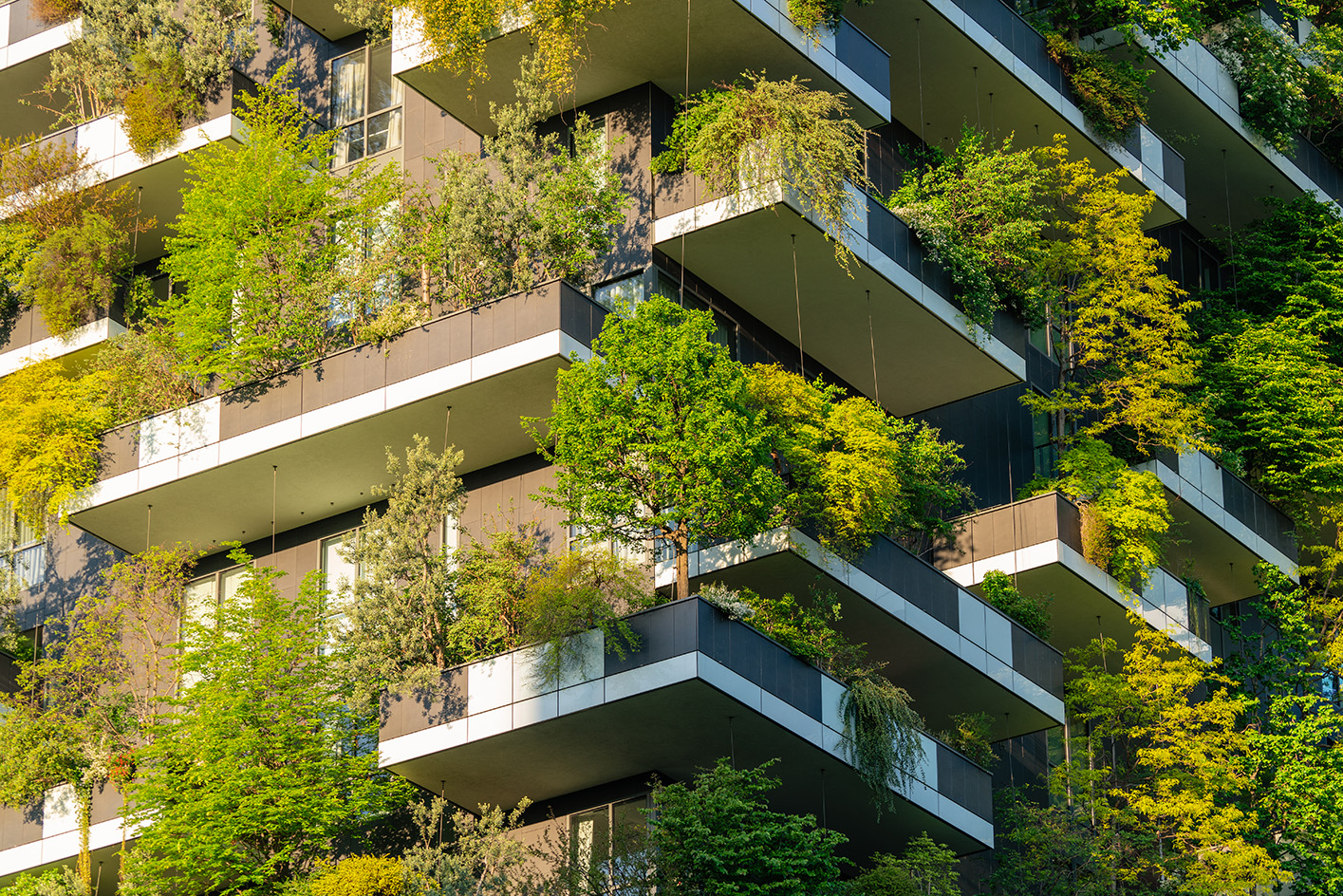 Detail of vegetation on the Vertical Forest, an example of biophilic architecture. here, close-up view showing lush vegetation on the balconies of the Bosco Verticale. Milan (Italy), April 25th, 2025 