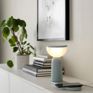 IKEA Bettorp dimmable lamp and wireless charger on shelf in home