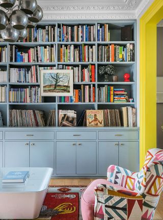 Living room with home library painted blue