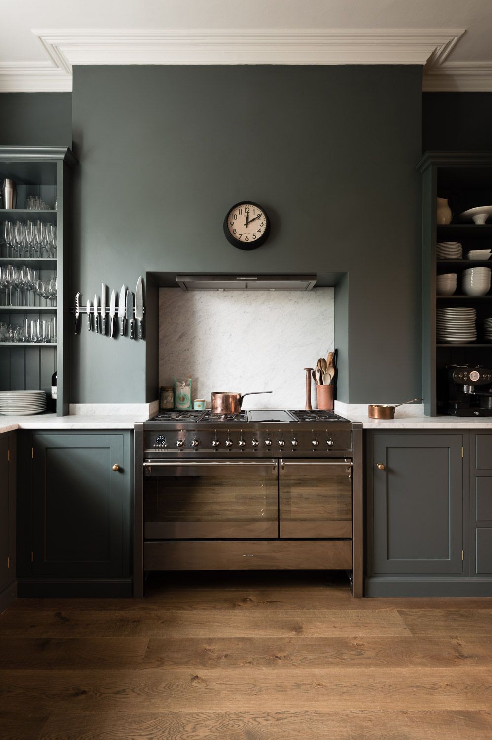 A dark green kitchen