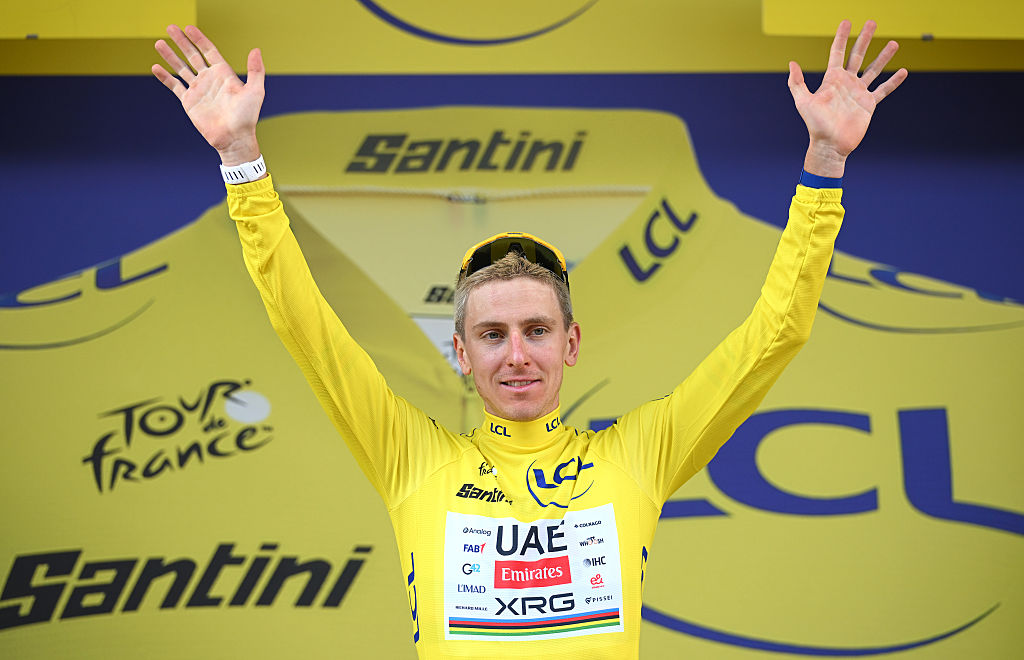 Tadej Pogacar on the yellow jersey podium