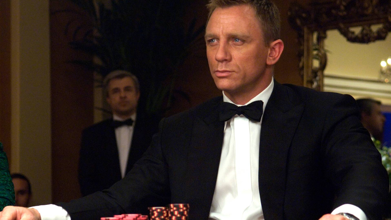Daniel Craig sits in a tuxedo at the card table in Casino Royale.