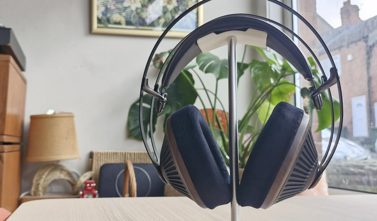 Meze Audio 105 Silva headphones on a light wooden table