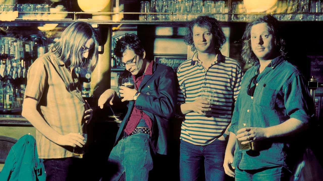 Mudhoney posing in a London bar