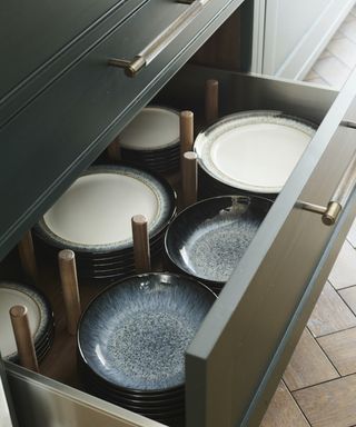 open kitchen drawer with plates inside