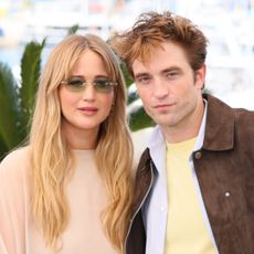 Jennifer Lawrence wears a floaty Dior outfit and carries a luxury Dior handbag for Cannes Film Festival photocall with Robert Pattinson