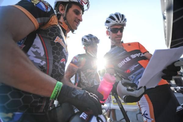 Team Planet Foods/Honeystinger Stefan Widmer (left) and riders check out the start list.