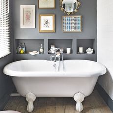bathroom with grey wall and bathtub
